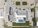 Aerial view of a luxury estate showcasing the roof, backyard pool, tennis court and landscaping at 6614 E North Ln, Paradise Valley, AZ 85253