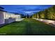 Expansive backyard with a modern pool and pristine landscaping at 6614 E North Ln, Paradise Valley, AZ 85253