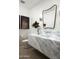 Modern powder room with a large marble sink, modern fixtures, and a decorative mirror at 6614 E North Ln, Paradise Valley, AZ 85253