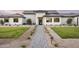 Imposing single-Gathering home featuring walkway and manicured landscaping and exterior stone accents at 6614 E North Ln, Paradise Valley, AZ 85253