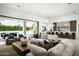 Bright and spacious living room with a large sliding glass door, hardwood floors and modern decor at 6614 E North Ln, Paradise Valley, AZ 85253