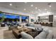 Modern living room showcasing an open floor plan, contemporary decor and seamless transition to the backyard at 6614 E North Ln, Paradise Valley, AZ 85253