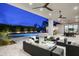 Stunning backyard features a pool, spa, fire pit, and cozy seating area for entertaining at 6614 E North Ln, Paradise Valley, AZ 85253