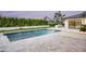 Beautiful pool area with fountains, travertine tile and fire feature, great for outdoor relaxation at 6614 E North Ln, Paradise Valley, AZ 85253