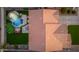 Aerial view of home showcasing backyard pool, putting green, and patio, with a roof overview at 6621 S Balboa Dr, Gilbert, AZ 85298
