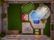 Aerial view of the backyard with pool, putting green, outdoor seating and manicured lawn at 6621 S Balboa Dr, Gilbert, AZ 85298