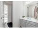 Clean bathroom with a single vanity, neutral tones, and a view into an adjacent room at 6621 S Balboa Dr, Gilbert, AZ 85298