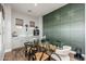 Bright dining area featuring modern decor, a glass table, and a built-in bar area at 6621 S Balboa Dr, Gilbert, AZ 85298