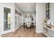 Bright dining area featuring a modern table, large windows, and a wine rack at 6621 S Balboa Dr, Gilbert, AZ 85298