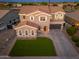 Aerial view of a two-story home with a well-manicured lawn and spacious driveway at 6621 S Balboa Dr, Gilbert, AZ 85298