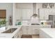 Modern kitchen featuring white cabinets, stainless steel appliances, and a stylish backsplash at 6621 S Balboa Dr, Gilbert, AZ 85298