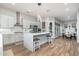 Bright kitchen featuring a large center island with seating, modern appliances, and stylish lighting at 6621 S Balboa Dr, Gilbert, AZ 85298