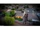 An aerial view of a neighborhood showcasing a house with solar panels and a landscaped backyard at 6623 S Classic Way, Gilbert, AZ 85298