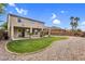 Spacious backyard with a well-maintained lawn and a gravel area at 6623 S Classic Way, Gilbert, AZ 85298