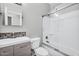 Modern bathroom with sleek vanity, glass-enclosed shower, and updated fixtures at 6623 S Classic Way, Gilbert, AZ 85298