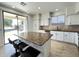 Modern kitchen featuring granite countertops and access to the backyard at 6623 S Classic Way, Gilbert, AZ 85298