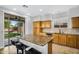 Bright kitchen featuring a center island, backyard access, and sleek appliances at 6623 S Classic Way, Gilbert, AZ 85298