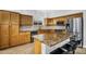 Well-equipped kitchen with granite countertops, stainless steel appliances, and breakfast bar at 6623 S Classic Way, Gilbert, AZ 85298