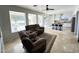 Open-concept living room with ample natural light and views of the kitchen at 6623 S Classic Way, Gilbert, AZ 85298