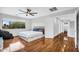 Spacious main bedroom with a large window, ceiling fan, and modern design at 6623 S Classic Way, Gilbert, AZ 85298