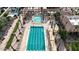 Aerial view of an outdoor swimming pool area with palm trees and lounge chairs at 6623 S Classic Way, Gilbert, AZ 85298