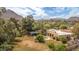 Breathtaking aerial view showcasing a private backyard with a pool and covered patio, surrounded by mature trees at 6735 E San Juan Ave, Paradise Valley, AZ 85253