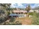 Resort-style backyard features a pool, covered patio, lush landscaping, and lounge chairs, perfect for outdoor living at 6735 E San Juan Ave, Paradise Valley, AZ 85253