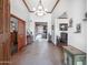 Bright foyer with stone floors, detailed trim, and an open view to the living room at 6735 E San Juan Ave, Paradise Valley, AZ 85253