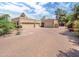 Spacious garage with multiple bays and a circular driveway offers plenty of parking, set within a well-maintained landscape at 6735 E San Juan Ave, Paradise Valley, AZ 85253
