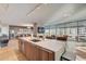 Gourmet kitchen with island and sink overlooking a living area with city views at 7120 E Kierland Blvd # 507, Scottsdale, AZ 85254