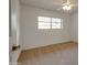 Bedroom with neutral carpet, ceiling fan, and window providing natural light at 7402 W Corrine Dr, Peoria, AZ 85381
