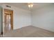 Bedroom with neutral carpet, ceiling fan, and large closet with mirrored doors at 7402 W Corrine Dr, Peoria, AZ 85381