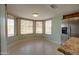 Bright breakfast nook with tile floors surrounded by windows and stainless steel appliances at 7402 W Corrine Dr, Peoria, AZ 85381