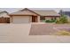 Charming single-story home with a two-car garage and low maintenance desert landscaping at 7402 W Corrine Dr, Peoria, AZ 85381