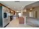Modern kitchen with granite countertops, stainless steel appliances, and an open design at 7402 W Corrine Dr, Peoria, AZ 85381