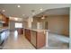 A spacious kitchen with a center island, granite countertops, and stainless steel appliances at 7402 W Corrine Dr, Peoria, AZ 85381
