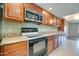 Modern kitchen design featuring granite countertops, ample cabinet space, and stainless steel appliances at 7402 W Corrine Dr, Peoria, AZ 85381