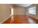Bright living room featuring hardwood floors and a large window for lots of natural light at 7402 W Corrine Dr, Peoria, AZ 85381