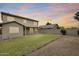 The backyard features a grassy lawn, patio, and well-manicured landscaping at 7624 E Plata Ave, Mesa, AZ 85212