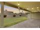 Cozy backyard patio and grassy area, perfect for entertaining at 7624 E Plata Ave, Mesa, AZ 85212