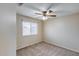 Carpeted bedroom featuring a large window and neutral walls at 7624 E Plata Ave, Mesa, AZ 85212