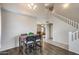 Dining Area with a dark wood floor and a stairwell leading upstairs at 7624 E Plata Ave, Mesa, AZ 85212