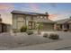 Charming two-story home with desert landscaping, a two-car garage, and solar panels on the roof at 7624 E Plata Ave, Mesa, AZ 85212