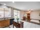 Open floor plan combines kitchen and living area with a view of the backyard at 7624 E Plata Ave, Mesa, AZ 85212