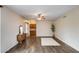 Open living room featuring hardwood floors, neutral walls and custom built-in cabinets at 7624 E Plata Ave, Mesa, AZ 85212