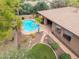 Aerial view of a backyard with a swimming pool and ample landscaping at 844 E County Down Dr, Chandler, AZ 85249