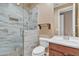 Bathroom featuring tiled shower with glass door, toilet, and sink at 844 E County Down Dr, Chandler, AZ 85249