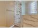 Elegant bathroom featuring marble-tiled walls and a seamless glass shower at 844 E County Down Dr, Chandler, AZ 85249
