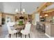 Cozy dining area adjacent to the kitchen and living space with seating for four at 844 E County Down Dr, Chandler, AZ 85249