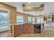 Open kitchen features a large island with sink, dishwasher, and views to the living area at 844 E County Down Dr, Chandler, AZ 85249